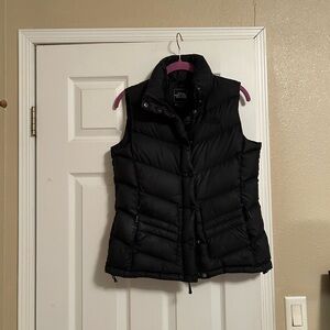 The North Face black quilted down vest. Size Medium